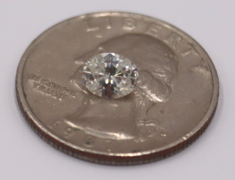 JEWELRY. Loose 0.75ct Oval Faceted Diamond. (1 of 3)
