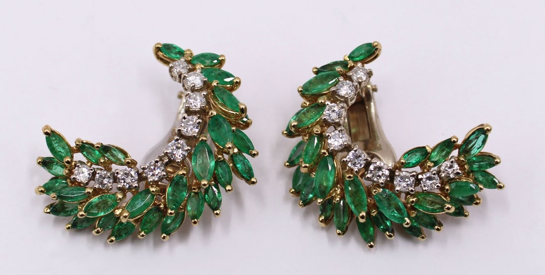 JEWELRY. Emerald and Diamond Clip-on Earrings.: Pair of 14kt yellow gold, marquis cut emerald, and diamond earrings. Earrings display a total of (54) marquis cut emeralds measuring on average approx. 4.5mm x 2.5mm; (18) diamonds measure on average