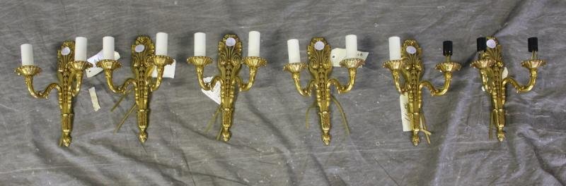 Reynaud Lighting Lot Including a Set of Six: Two Arm Brass Sconces. From an East 57th Street NYC storage facility. Dimensions: 7.75" wide x 11" high. Condition: Good.