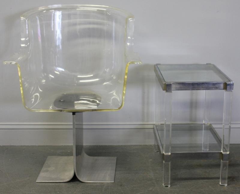 Midcentury Lot of 2 Items.: A Lucite swivel chair on a metal base - 22" w x 21" d x 33" h. With a chrome Lucite and glass end table - 19" w x 13" d x 20" h. From an East 69th St NYC estate.