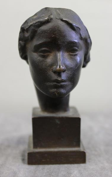Small Bronze Bust of a Woman.: Signed Victor Salvatore and dated 1922 on the right side of the base. Initialed "R.B.W" on the back of base. From a Larchmont, NY location. Dimensions: 1.437" wide x 1.437" deep x 4.25" high.