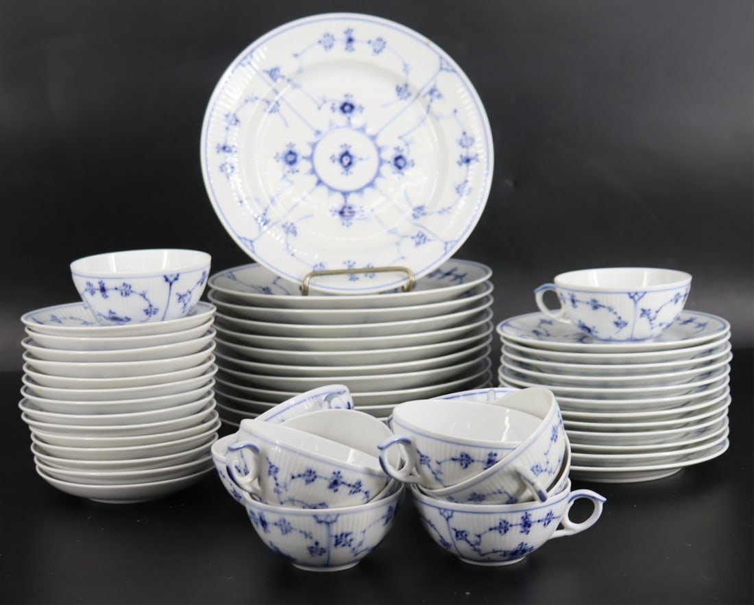 Part Dinner Service Royal Copenhagen Blue Fluted: To include 1) 12 dinner plates (9"), 2) 12 bread plates (6.75"), 3) 14 saucers, and 4) 13 tea cups. From a Larchmont, NY estate.