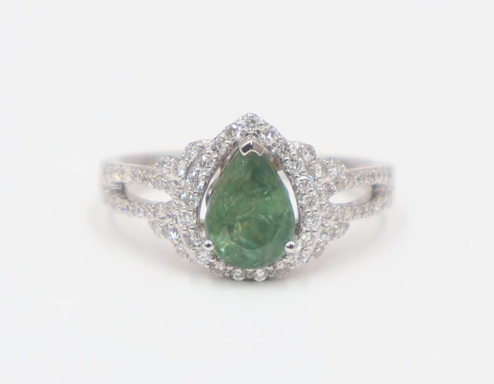 JEWELRY. GIA/GAL 18k Alexandrite and Diamond Ring.: 18kt white gold ring displaying a central pear faceted Alexandrite surrounded by round full cut diamond accents. Accompanied by a June 27th, 2022 GIA Alexandrite Report no. 1226499586 stating this is