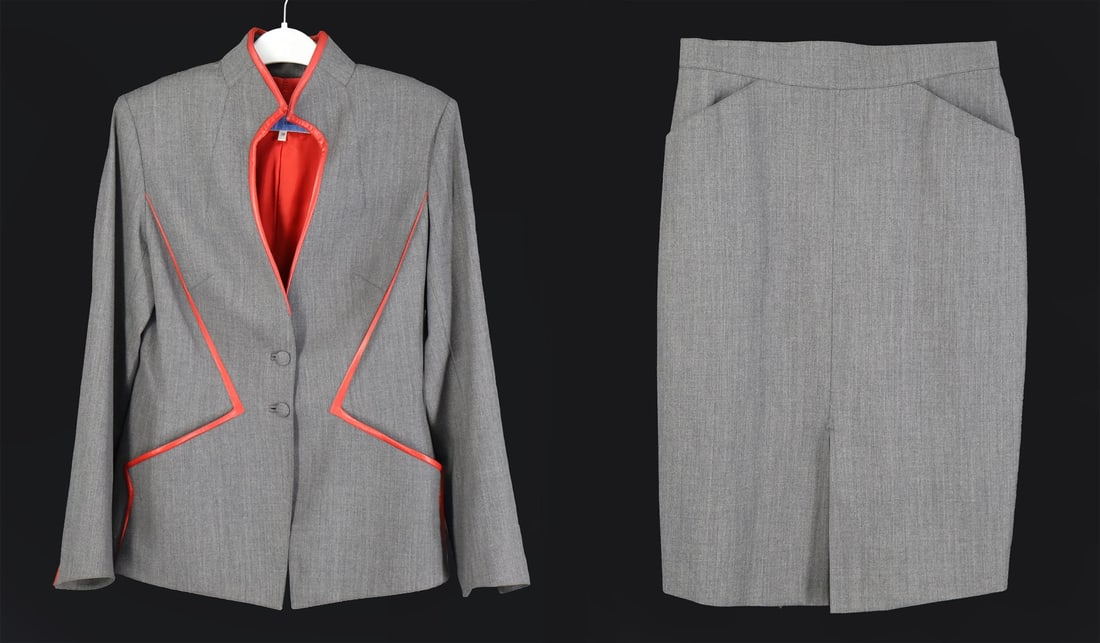 COUTURE. Thierry Mugler Skirt Suit Set.: A grey Thierry Mugler wool blazer and matching skirt with red faux leather accents and shoulder pads. From the 2001 Fall/Winter collection. Blazer label reads, "Thierry Mugler Couture 38 100% lain/woo