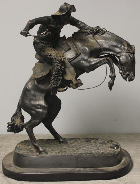 REMINGTON, Frederic. Bronze "Bronco Buster.": Recast. Mounted on a black marble base. Stamped on base of bronze. Frederic Remington, American, 1861- 1909. From a Northport, NY estate. Dimensions: 15" wide x 7" deep x 21" high. Condition: Overall 