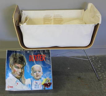 Midcentury Style Laminated and Steel/Chrome Baby's: Bassinet. Designed by Scott Wilson for Coffi. Bassinet was featured in the television series Dexter. From a Bronxville, NY estate. Dimensions: 19.5" wide x 24" wide x 30" high.