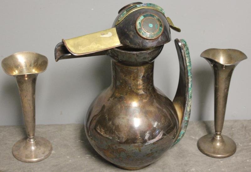 Midcentury Los Castillo Large Mixed Metal: Silverplate Bird Pitcher with Turquoise. With a pair of small sterling weighted vases. From a Mamaroneck, NY estate. Dimensions: Pitcher - 12.5" high. Conditions: Top of pitcher is bent.