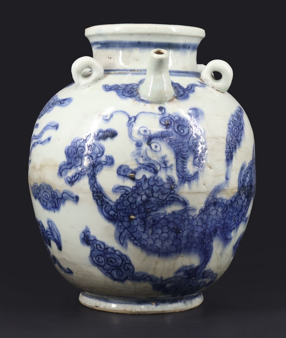 Chinese Blue and White Wine Jug.: A Chinese blue and white wine jug with four lug handles displaying a dragon amongst clouds. Apparently unmarked. From a Brooklyn, NY estate. Dimensions: Jug measures approx. 12" in height.