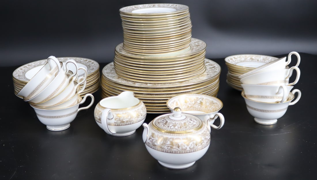 Lot Of Wedgwood Gold Florentine Porcelain .: 10 Dinner Plates 10.5"d, 9 Salad Plates 8"d , 18 Bread Plates 6"d and 8 Soup Bowls 8"d. 10 Cups 2.50"h and 10 Saucers 5.75"d. Lidded Sugar bowl and creamer. From a Armonk NY Estate.