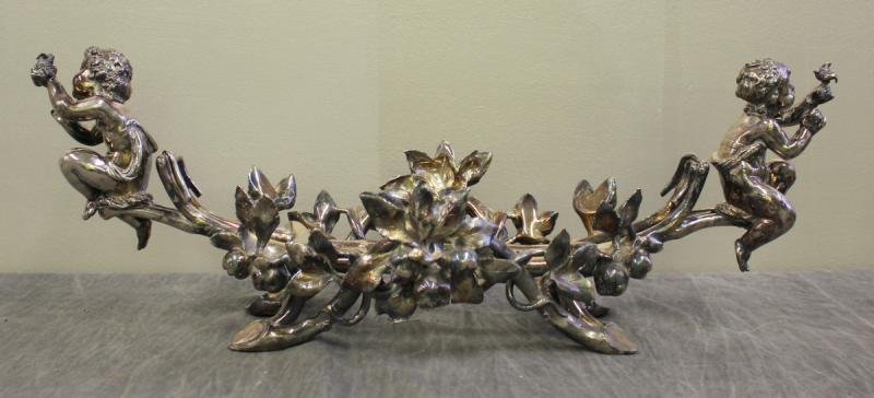 Christofle Silverplate Holder with Cherubs.: No bowl insert. From a Newburgh, NY estate. Dimensions: 22" wide x 10" deep x 8" high.