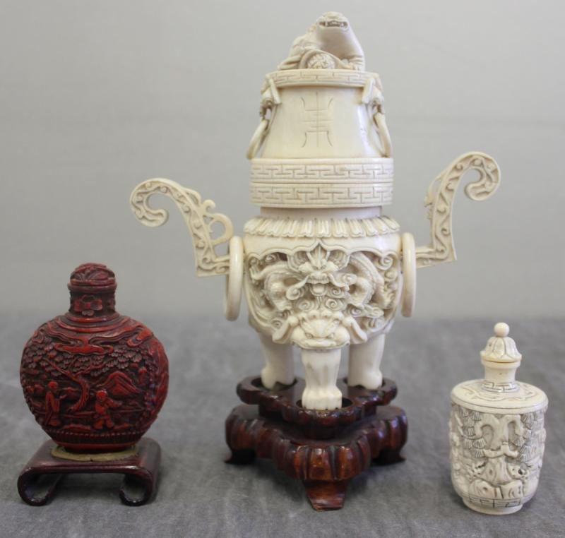 Asian Lot of 2 Snuff Bottles & an Ivory: Urn. Ivory snuff bottle is signed. From a Westport, CT estate. Dimensions: Cinnabar snuff bottle - 2.5" wide x 3.25" high, Ivory snuff bottle - 1.5" wide x 3" high, and urn - 6.5" wide x 6.5" high. Co
