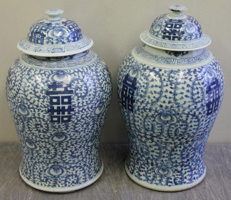 Signed Antique Chinese Blue and White Ginger Jars.: A near pair of two similar large blue and white ginger jars with lids. Each signed. From a Larchmont, NY collector. Dimensions: 8.5" diameter of base x 18.25" high. Condition: Minor chips or glaze los