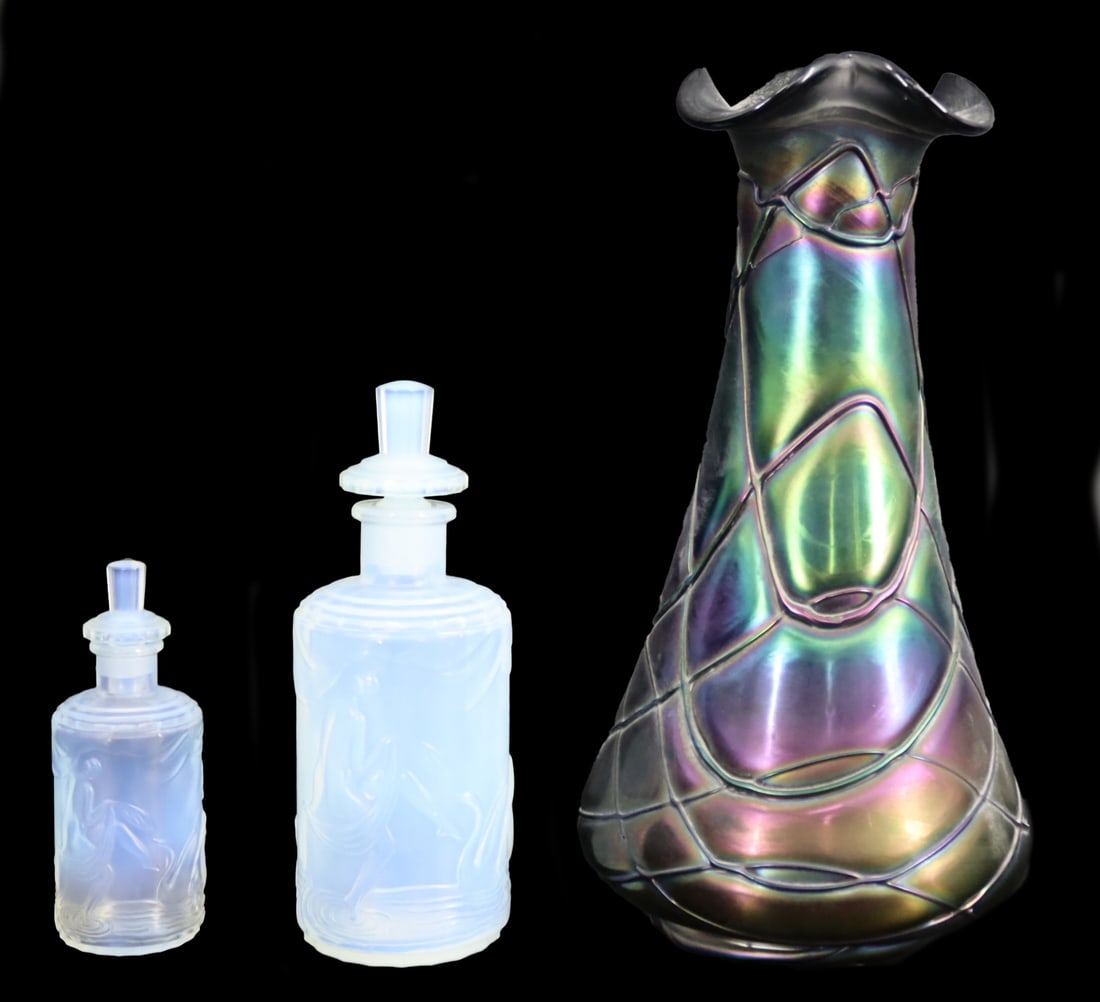 Vintage Art Glass Grouping Including Lalique: 2 Opalescent Lalique France lidded bottles (6" h & 4" h), together with a Loetz style art glass vase (9.75" h). From a Roslyn, NY estate.