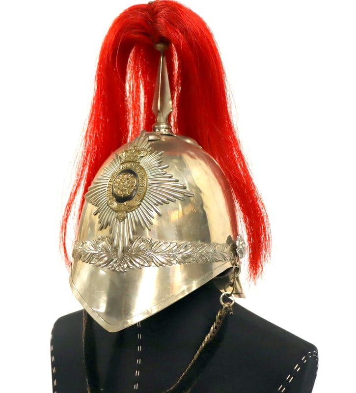 MILITARIA. Hampshire Yeomanry Carabineers Albert: Helmet with Bandsman's Plume. A Hampshire Yeomanry Carabineers Helmet. Features a white metal shell adorned with a rayed star other ranks helmet plate at the center. The front is decorated with laurel