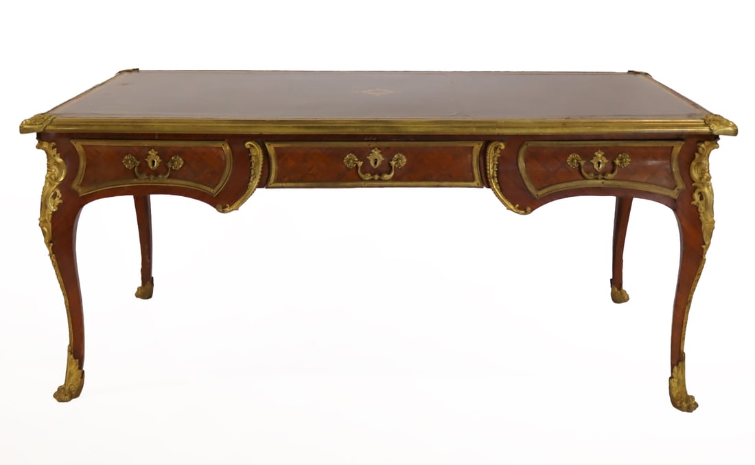 Finest Quality Louis XV Style Leathertop Bureau: Plat. A great large size Kingswood with brown leathertop. Bronze trim all around with very fine ormalou, parquetry inlay and raised on claw feet. From a Westchester County, NY estate. - Dimensions: 30