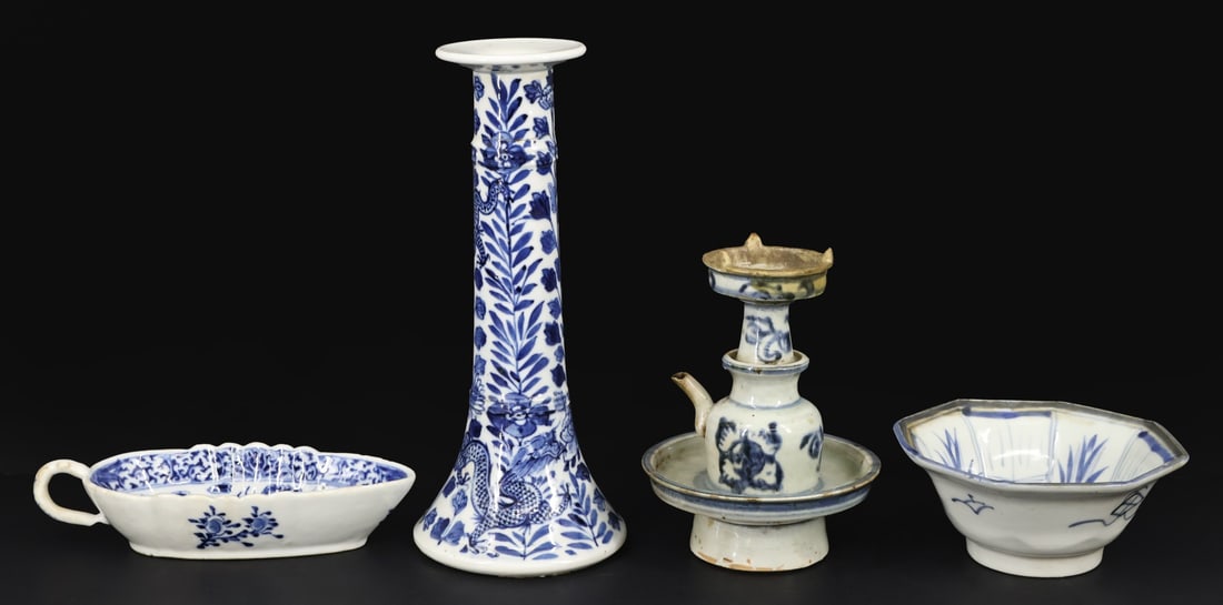 Grouping of Chinese Blue and White Porcelain.: Includes a gravy dish displaying dragons chasing the flaming pearl; a candlestick displaying dragons and flowers; a footed octagonal dish displaying a fan and vegetal imagery; and a footed water dropp
