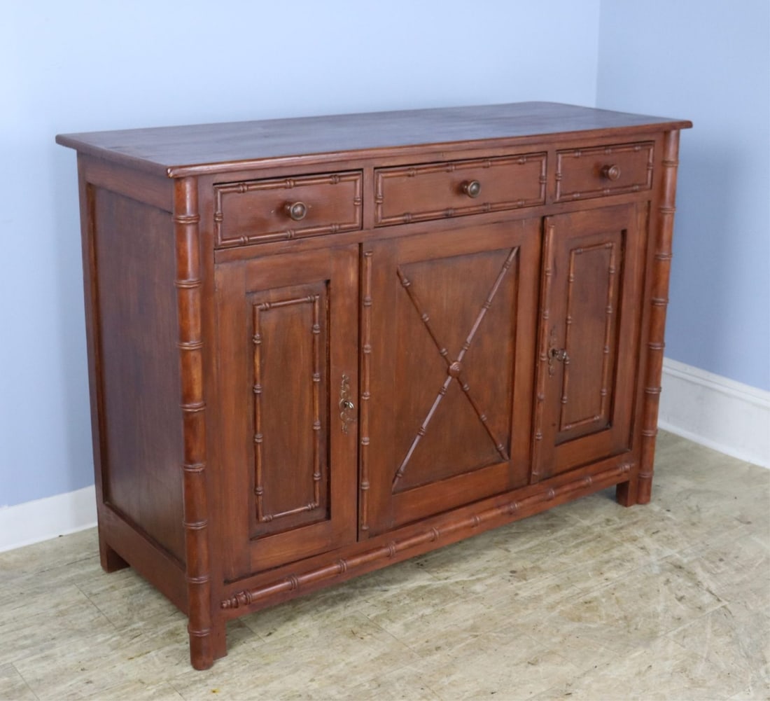French Three Drawer Faux Bamboo Buffet.: A three door enfilade or buffet with three compartments and a non-adjustable interior shelf. Both doors lock easily with a key, though the right door has a slight warp at the top, visible in the thumb
