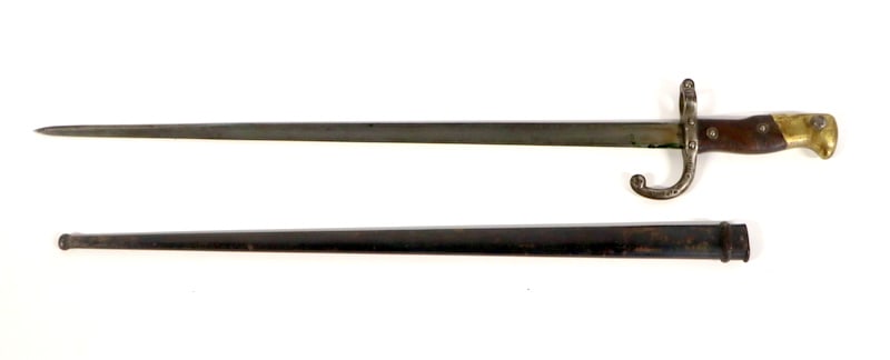 MILITARIA. (2) Antique French Bayonets.: Included in the collection is a French M1866 Chassepot Saber Bayonet, manufactured at the Chatellerault Arsenal in January 1872. This piece features a brass handle, a steel crossguard, and a single-ed