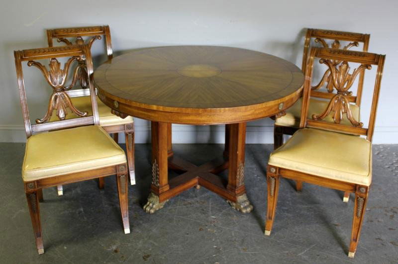 Vintage Empire Style Dining Set.: Includes a dining table with bronze feet and trim. With 3 leaves, and four matching chairs. From a Forest Hills, NY estate. Dimensions: Table- 46.5" diameter x 29" high with three 16.5" leaves, Chairs