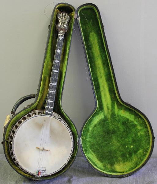 Vintage Vega Signed 4-String Banjo with Resonator.: In hard case. Fret board signed "J.P. Epple?" and case signed "Mark Ross." From a Hastings-on-Hudson, NY collector. Dimensions: 33" long with 11.5" diameter drum. Condition: Banjo is in good condition