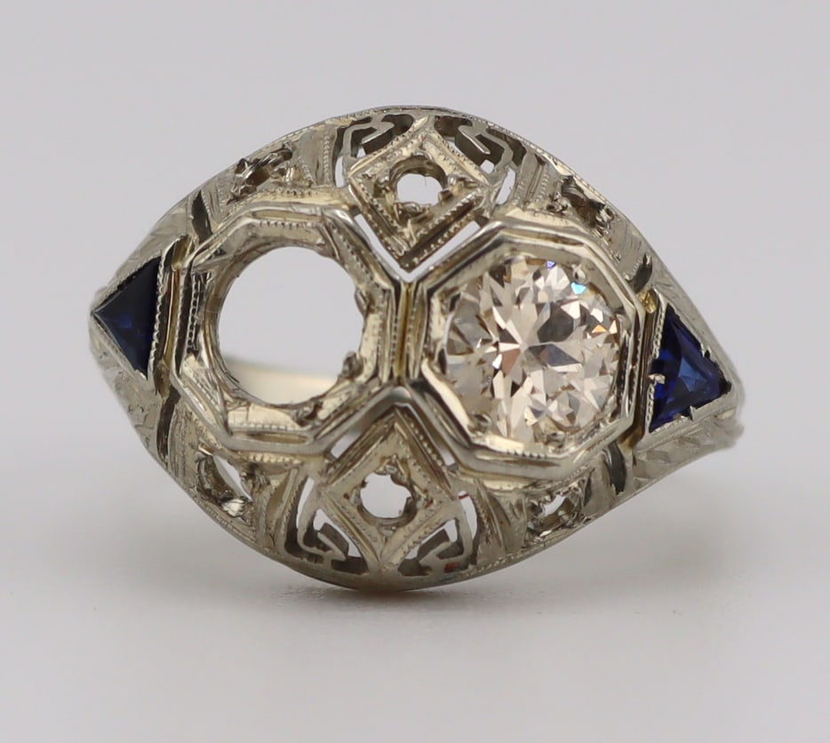 JEWELRY. Art Deco 18kt Gold, Diamond and Gem: Ring. Art Deco 18kt white gold ring displaying a single Old European cut diamond and (2) triangular faceted blue gems. Total approx. weight of the ring is 2.2 dwt (gross). Ring size - 3 3/4. From a Ne