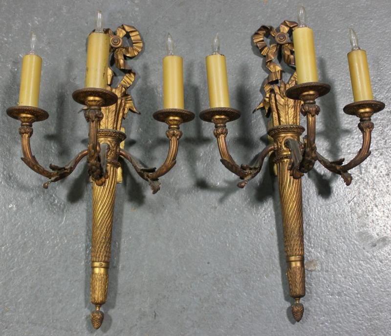 Pair of Antique French Gilded Bronze 3 Arm Sconces: With quiver of arrows and bowknot design. From a Derby, CT home. Dimensions: 12" wide x 22" high.