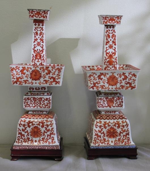 Pair of Chinese Iron Red Candlesticks.: On hardwood bases. From a NYC location. Dimensions: 5" wide x 5" deep x 14.75" high.