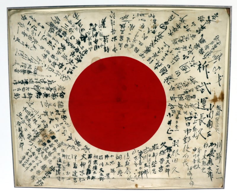 MILITARIA. Imperial Japanese Hinomaru Good Luck: Flag. A large and impressive Imperial Japanese nisshoki hinomaru (circle of the sun) yosegaki hinomaru (good luck flag). From a Manhattan, NY estate. Dimensions: flag measures approx. "34 w x 29&