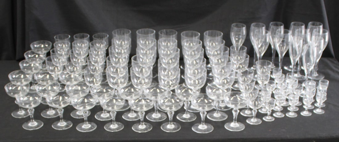 Large Collection of Baccarat Crystal Stemware: To include: 25 water (?) (6.5"), 22 saucer champagne (4 7/8"), 21 sherry (3 1/8"), 15 white wine (?) (5 5/8"), 9 red wine (?) (8.5"), 5 unknown (4.5"), 3 champagne flutes (8.5"), 1 unknown (4 1/8"). F
