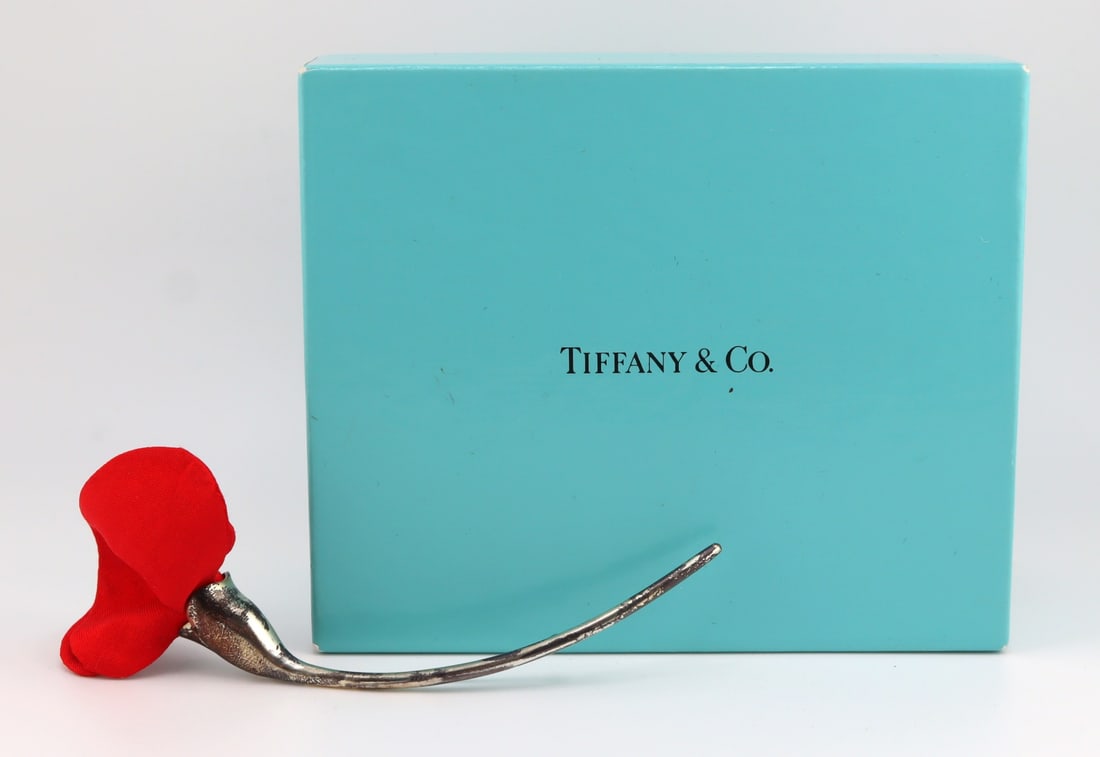 JEWELRY. Elsa Peretti for Tiffany & Co. Amapola: Brooch. Elsa Peretti for Tiffany & Co. Amapola sterling brooch with red silk floret. Inscribed, "Tiffany & Co. © Elsa Peretti 925 Spain". Accompanied by a Tiffany & Co. lidd