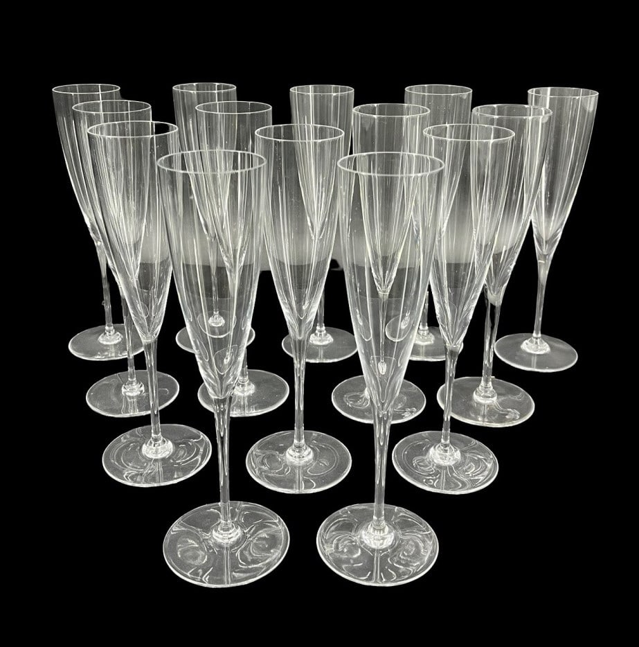 (14) BACCARAT Champagne Flute Glasses: (14) crystal champagne flute glasses. Stamped on the underside of each. From a Norwalk CT estate. - Dimensions: 9.25" h