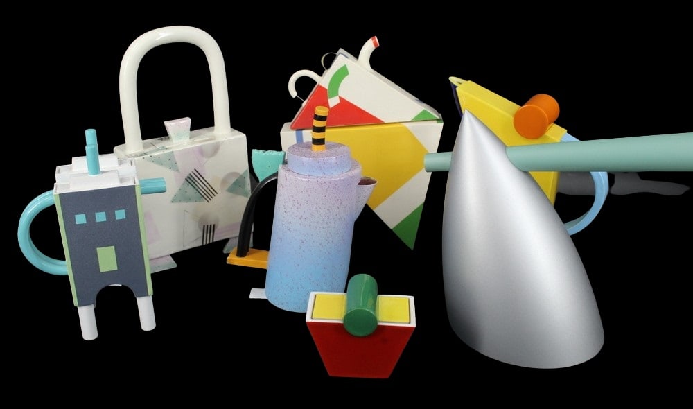 Group of 7 1980's Bold Geometric Teapots: 1) "Blue & White Building", "J.R. '85", 2) "Purple Cylinder", "BX (?) '85", 3) "Red Yellow Green" sugar bowl, "A.R.", 4) "Yellow Or