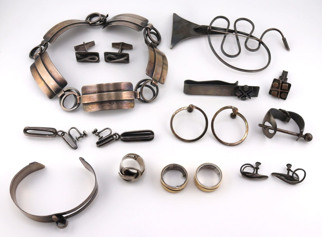 JEWELRY. Collection of LOBEL Sterling and 14kt: Gold Jewelry. Includes a large Lobel sterling trumpet brooch; a pair of Lobel sterling circular earrings with screw backs; a Lobel sterling tie bar; a Lobel sterling cuff bracelet with openwork panel;