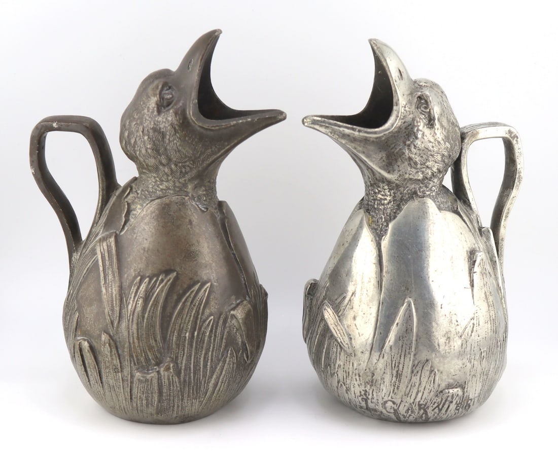 Pair of Jean Garnier Pewter Chick Jug.: Pair of signed Jean Garnier pewter jugs displaying chicks emerging from eggs. Signed, "J. Garnier". and the underside is impressed with, "Stain Garanti Pur". From a Bloomfield, NJ