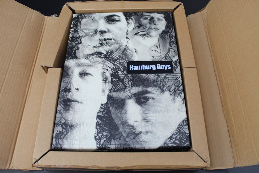 Hamburg Days Signed Limited Edition Slipcased: "Hamburg Days", 2 volume deluxe slipcased edition, "Main" and "Paintings", book plate signed by George Harrison in Main volume, #159 of 250 sets. "This folder contai