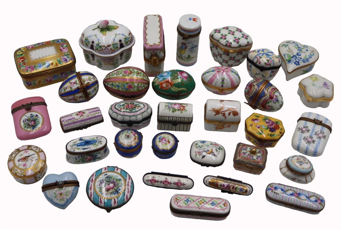 (33) Antique French Limoges Pillboxes.: (36) assorted French Limgoes pillboxes and lidded boxes of various shapes sizes and motifs. From a Great Neck, NY estate. Dimensions: rectangular hinged gilt box measures approx. 3.5" w x 2.5&quo