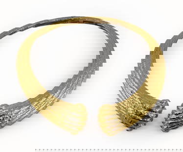 JEWELRY. Italian 18kt Gold Hinged Collar Necklace.: Italian 18kt yellow gold handhammered hinged collar necklace with scroll form terminals. In the style of Ilias Lalaounis. Stamped, "750" within a lozenge form frame. Total approx. weight of