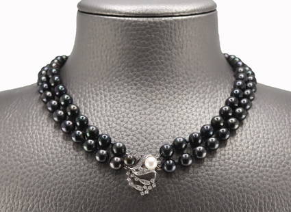 JEWLERY. 14kt Gold, Diamond and Pearl Necklace.: Double strand necklace of individually knotted black pearls with a 14kt white gold clasp displaying a single approx. 6.5mm white pearl accented by pave diamonds. Black pearls measure approx. 8.0mm eac