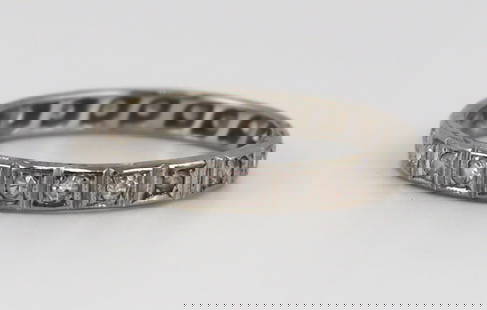 JEWELRY. 18kt Gold and Diamond Eternity Band.: 18kt white gold eternity band ring displaying (20) single cut diamonds. Apparently unmarked. Total approx. weight of the ring is 1.2 dwt (gross). From a Port Chester, NY estate. Dimensions: ring measu