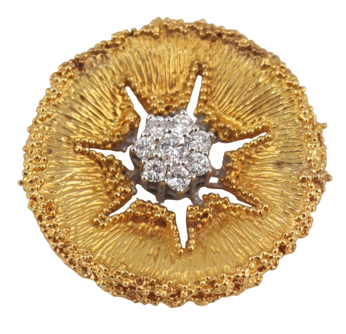 JEWELRY. Signed 18kt Bi-Color Gold and Diamond: Brooch. Signed 18kt yellow gold circular brooch with beautiful striated finish accented by a mottled textural border and central starburst opening displaying a cluster of (8) round brilliant cut diamo