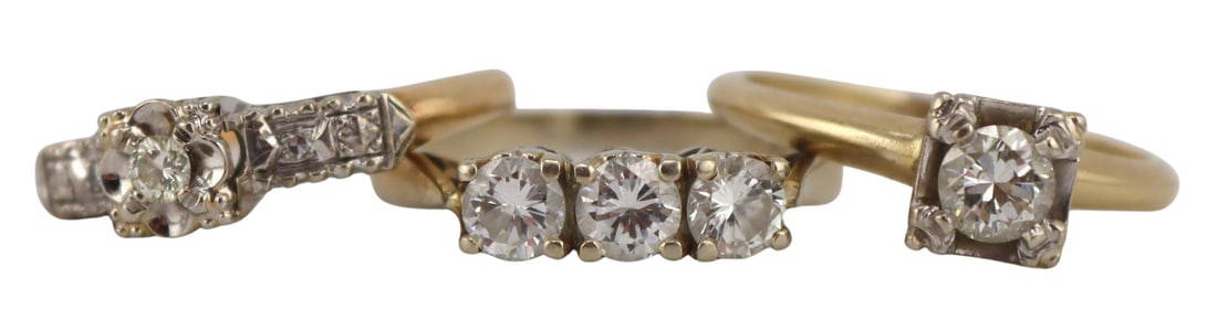 JEWELRY. (3) 14kt and 18kt Gold and Diamond Rings.: Includes an 18kt white gold band ring displaying (3) prong-set round brilliant cut diamonds - stamped, "750", diamonds measure approx. 4.0mm each, total approx. diamond weight is 0.75 cttw,