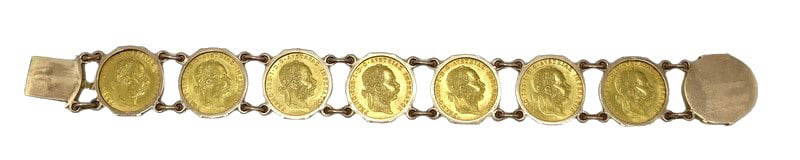 JEWELRY. Austrian 1 Ducat Gold Coin Bracelet.: An Austrian 14kt yellow gold bracelet with (8) bezel set 1915 1D (Ducat) Austrian Restrike gold coins struck in 0.986 fine gold. The bracelet is stamped "585" along with a pictorial gold pur
