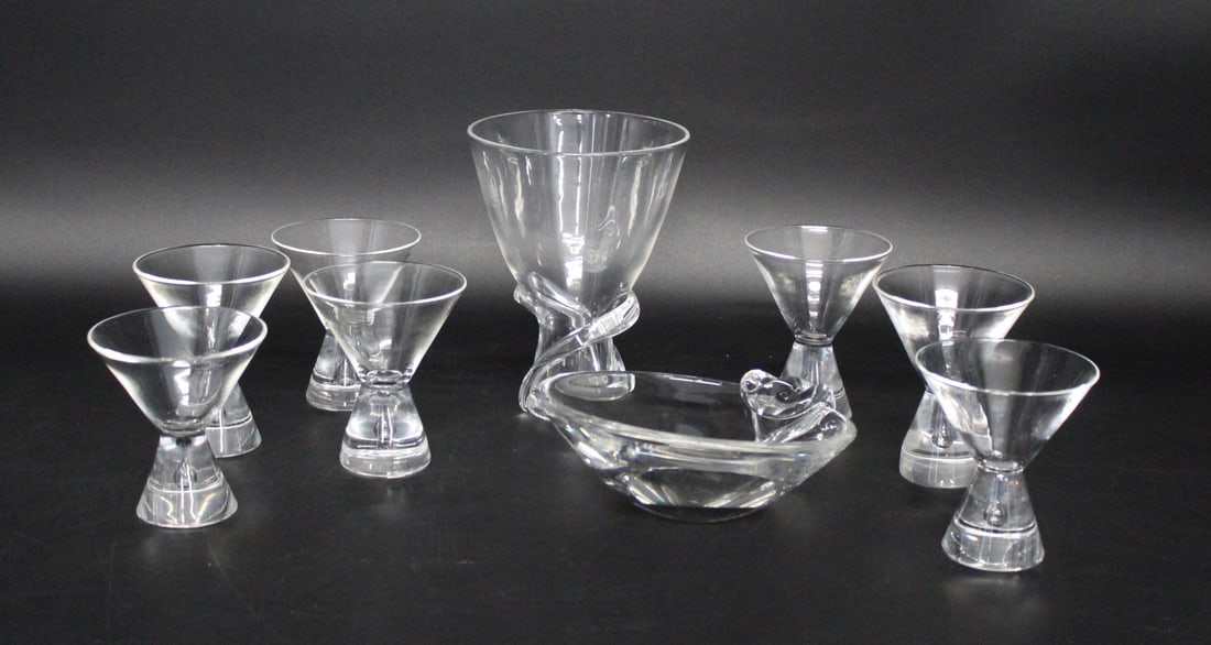 STEUBEN Lot Of Assorted Glass Items: To include 7 glasses (4" h x 3.5" dia), 1 vase (6.5" h x 5" dia), 1 bowl (6" dia). From a Bronxville NY estate.