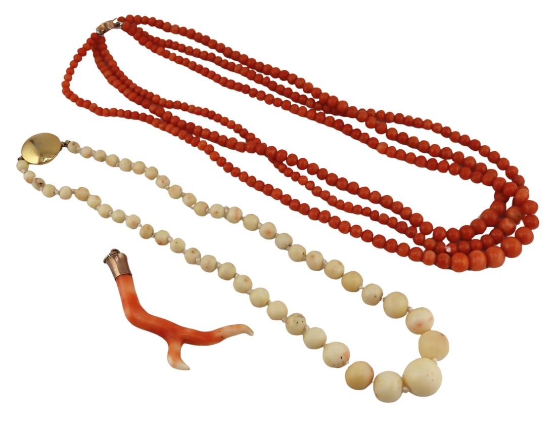 JEWELRY. Coral Jewelry Grouping.: Includes a Victorian triple strand graduated salmon coral bead necklace displaying an 11kt yellow gold clasp; an 8kt yellow gold mounted coral branch pendant; and a graduated single strand angel skin 