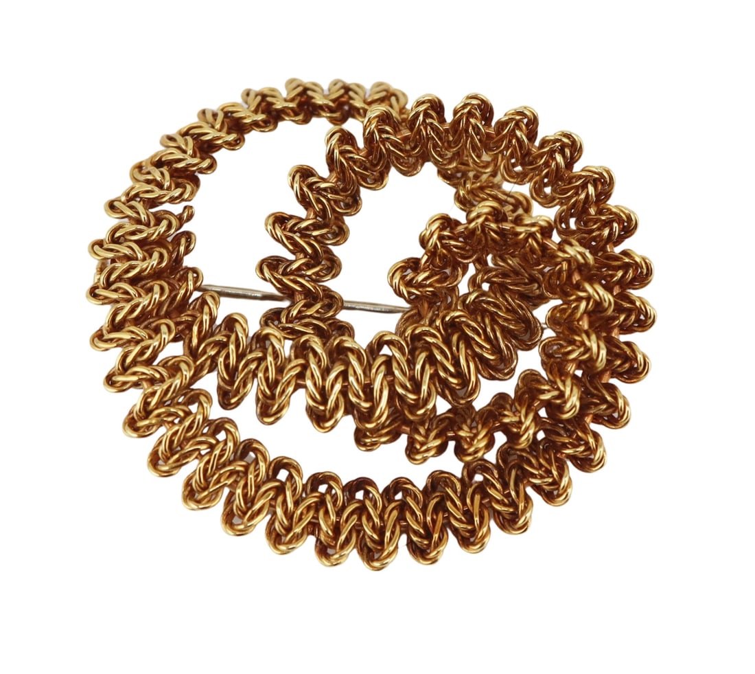 JEWELRY. French Bucherer 18kt Gold Brooch.: French Bucherer 18kt yellow gold swirl form brooch. With applied plaque etched, "Bucherer France 18K". Total approx. weight of the brooch is 11.3 dwt (gross). From a Larchmont, NY estate. Di