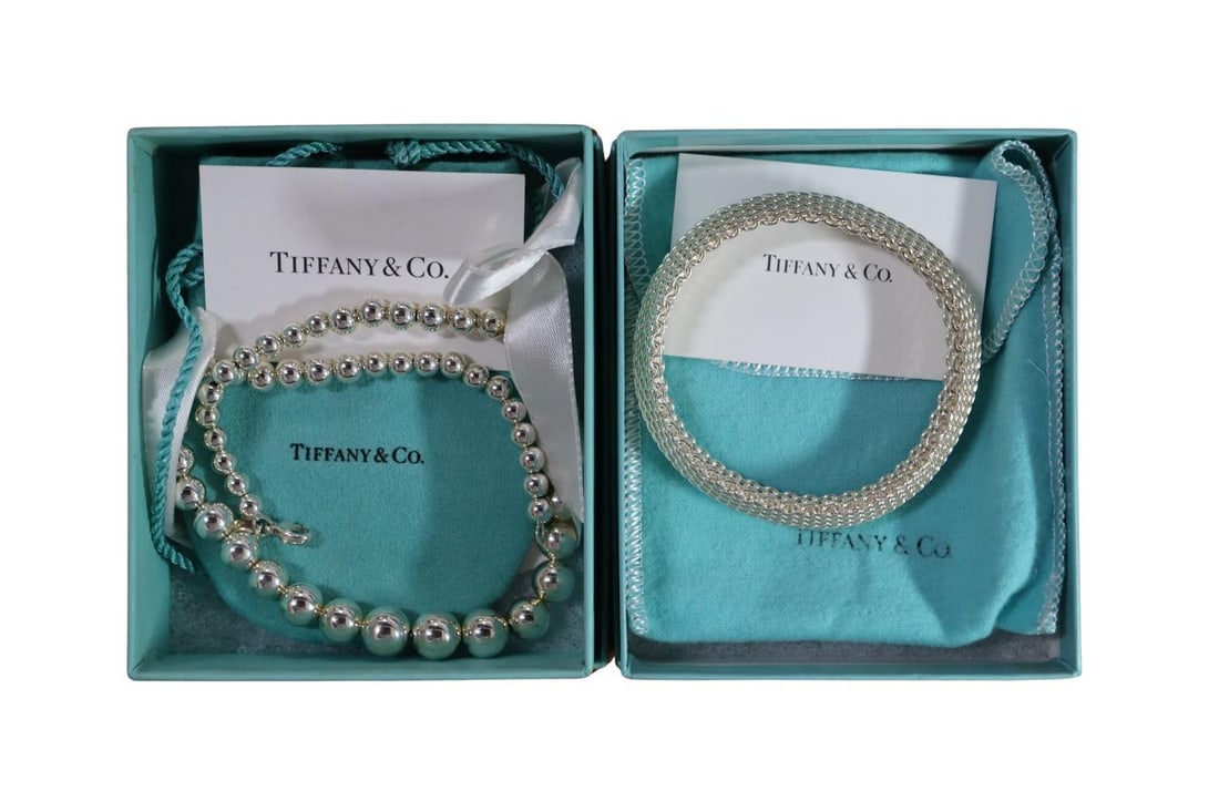 JEWELRY. Tiffany & Co. Cased Sterling Jewelry.: Including a cased Tiffany & Co. Sterling Somerset Mesh 15 mm bracelet - stamped, "Tiffany & Co. 925"; and a Tiffany & Co. sterling graduated bead necklace - stamped, "Tiffan