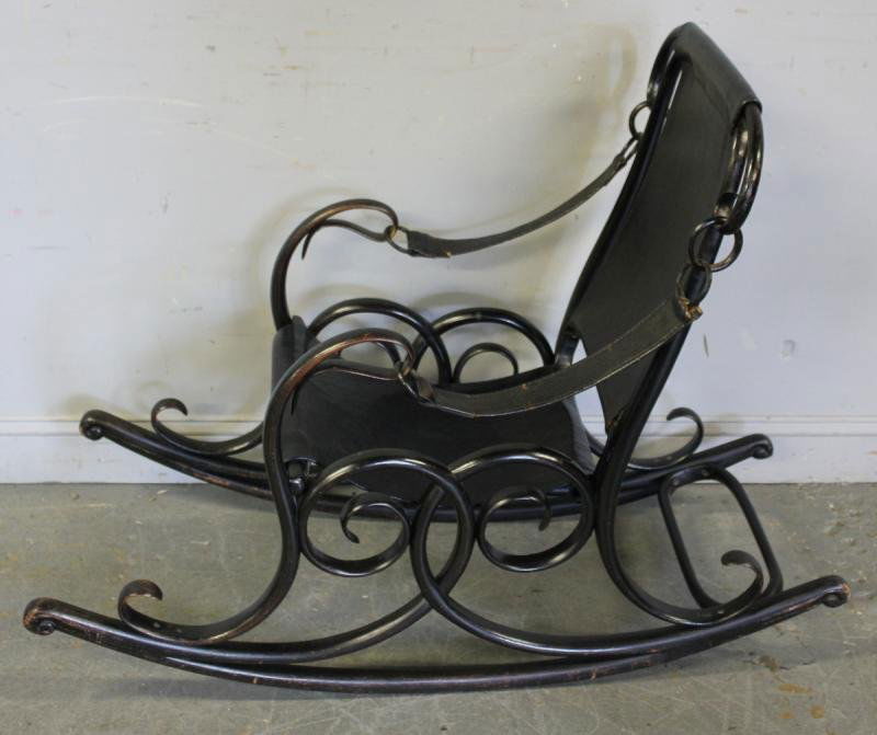 Unusual Austrian Bentwood Rocker with: Leather Upholstery. Possibly Joseph Hoffman. Purchased in Paris approximately 50 years ago. Dimensions: 22.5" wide x 48" deep" 36" high.