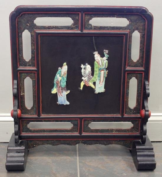 Signed Antique Chinese Lacquered Table Screen.: With unusual applied porcelain figures. From a New City, NJ home. Dimensions: 23" wide x 11" deep x 25" high.