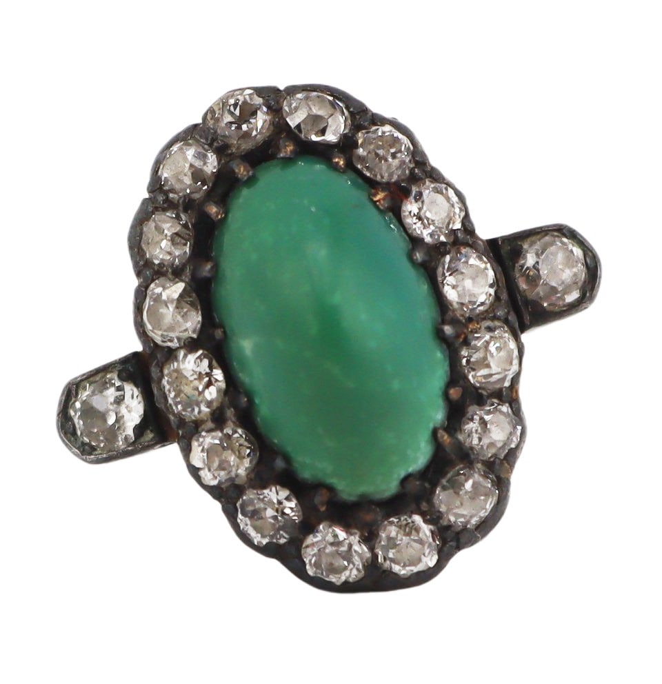 JEWELRY. Antique Silver-Topped Gold Turquoise and: Diamond Ring. Antique silver-topped 18kt yellow gold cocktail ring displaying a central prong-set sugar loaf turquoise with a surround of Old Mine cut diamonds and (2) additional Old Mine cut diamonds