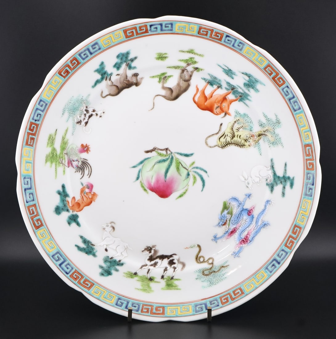 Chinese Enamel Decorated Plate.: A footed plate displaying the twelve zodiac animals surrounding a peach with bats to the underside. Base bears a 6 character mark. From a Mount Laurel, NJ estate. Dimensions: measures approx. 10"